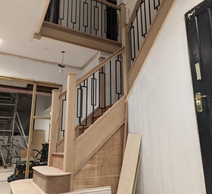 New oak staircase with bullnose bottom steps and metal spindles