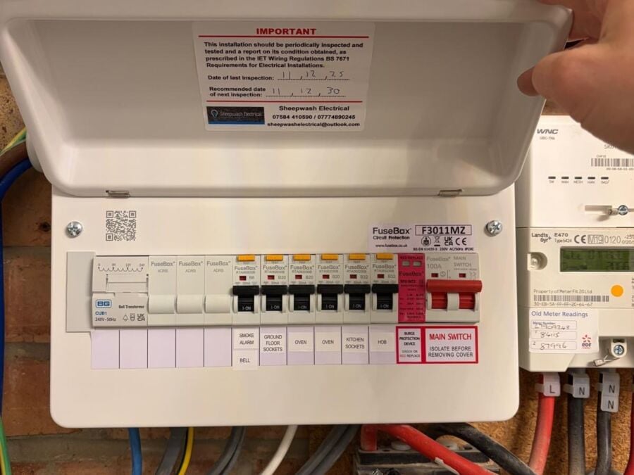 Modern consumer unit installation with circuit breakers and RCD protection, showing main switch and labelled circuits including soft transformer