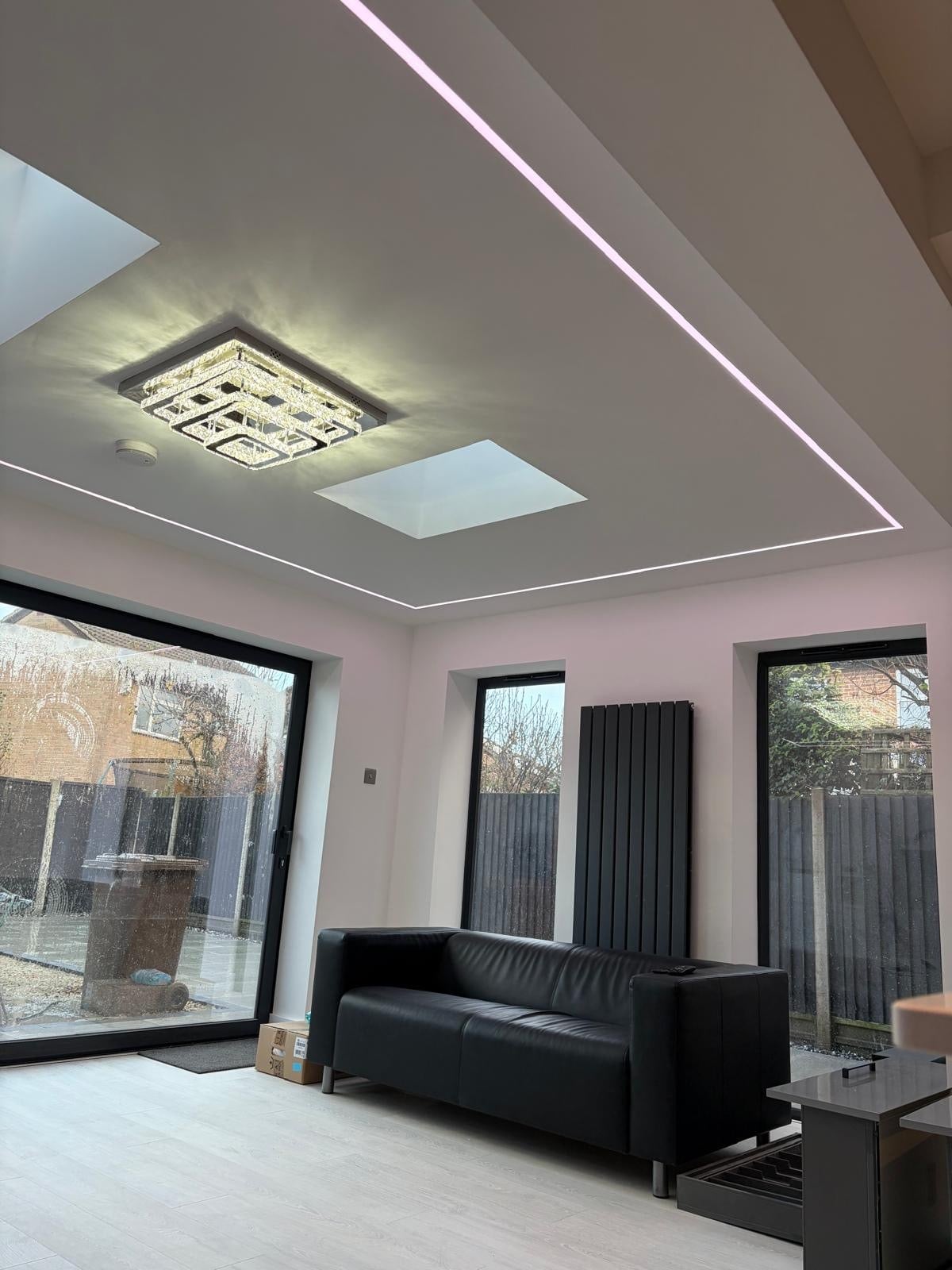 Modern extension interior with roof lantern and recessed LED ceiling, managed by Brooks Contractors