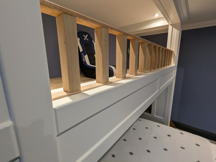 Close up of the timber spindle balustrade on a bespoke mezzanine platform