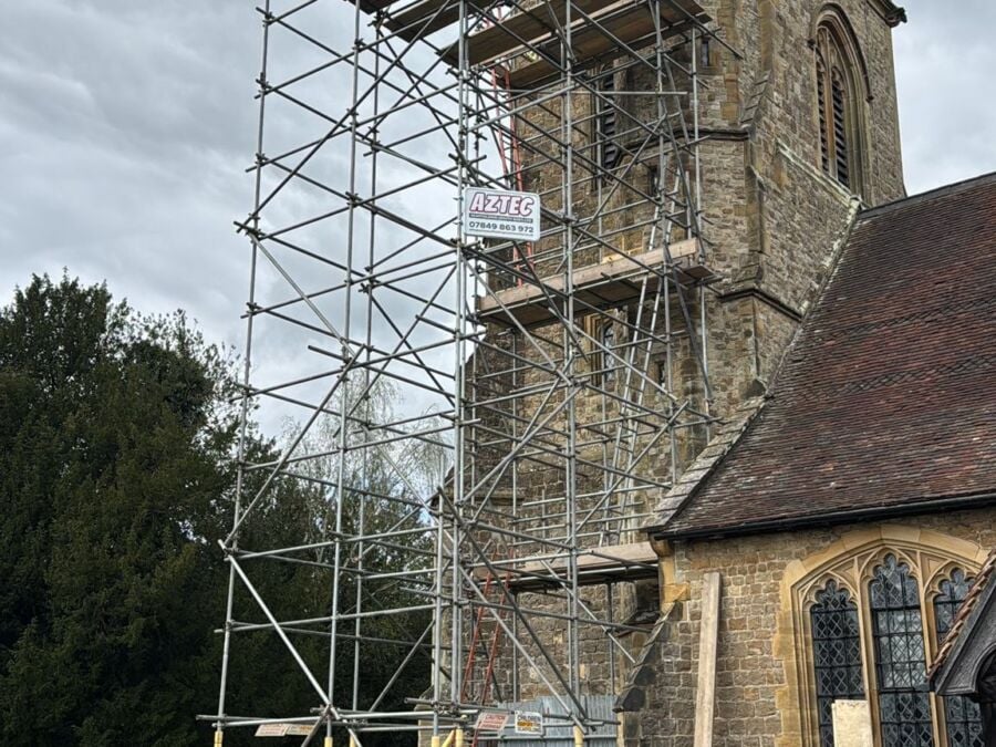 Scaffolding erected around a church tower