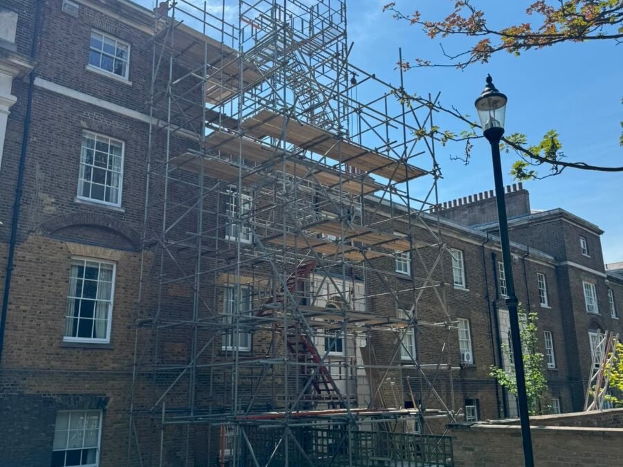 Scaffolding erected on the rear of a period brick building