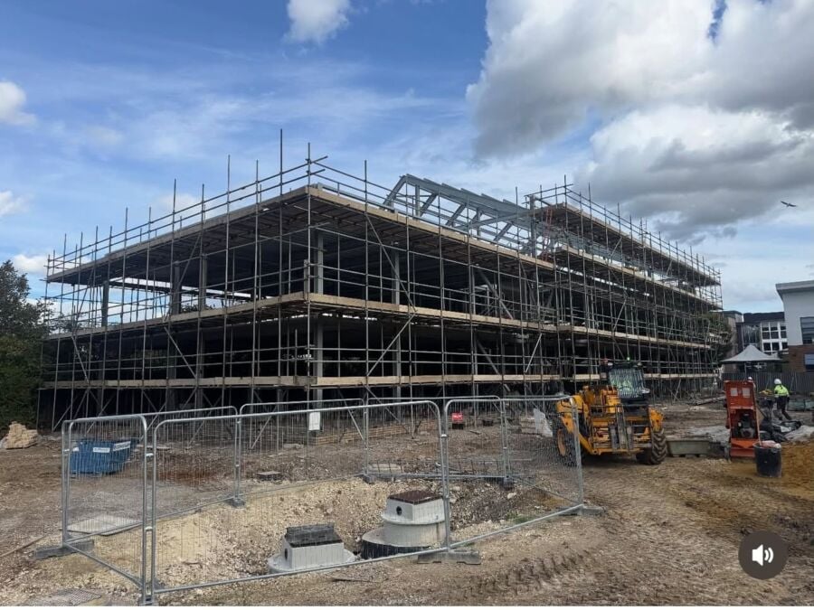 Scaffolding around a new build frame on an active construction site