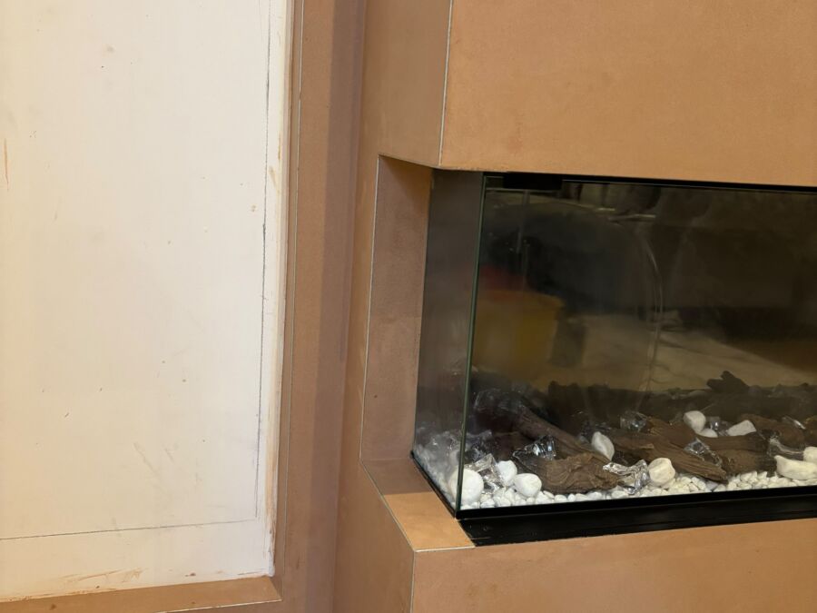 Freshly plastered media wall with a built in fire recess
