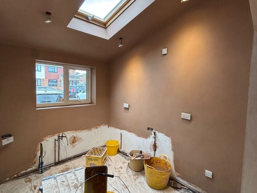 Loft room skimmed with fresh plaster, with a roof window and new downlights