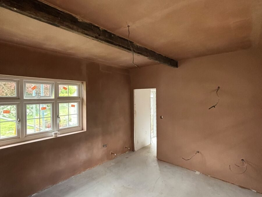 Freshly plastered bedroom with the steel beam boxed in