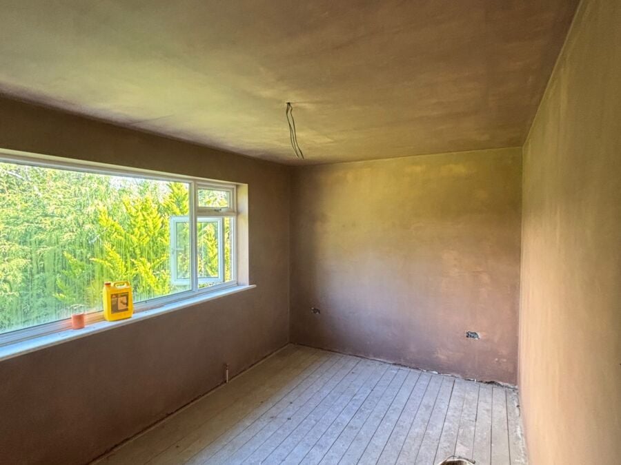 Room skimmed with fresh plaster above original floorboards