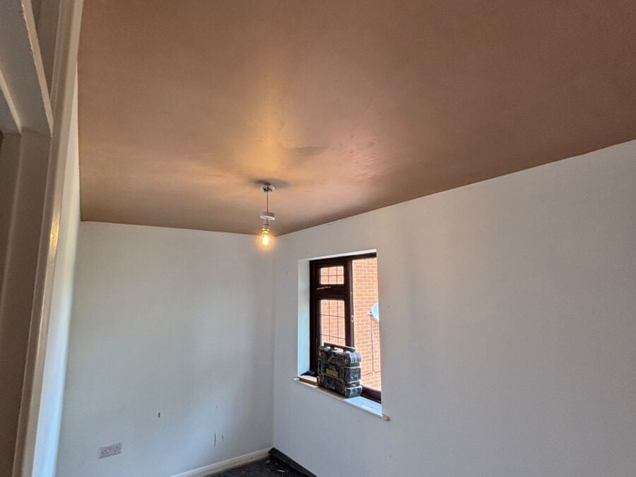 Hallway freshly plastered with the first walls painted white