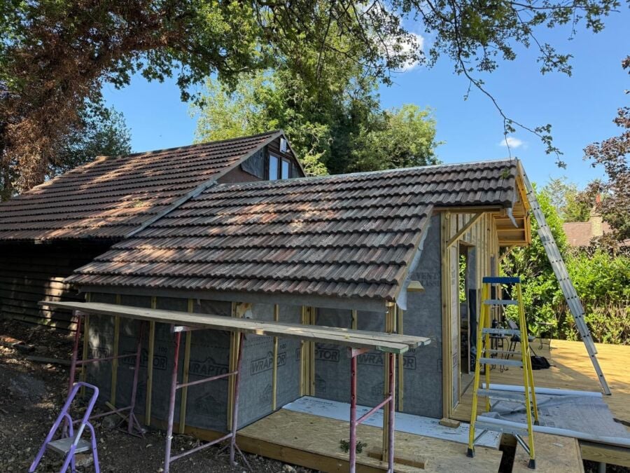 New concrete tile roof on a garden room under construction